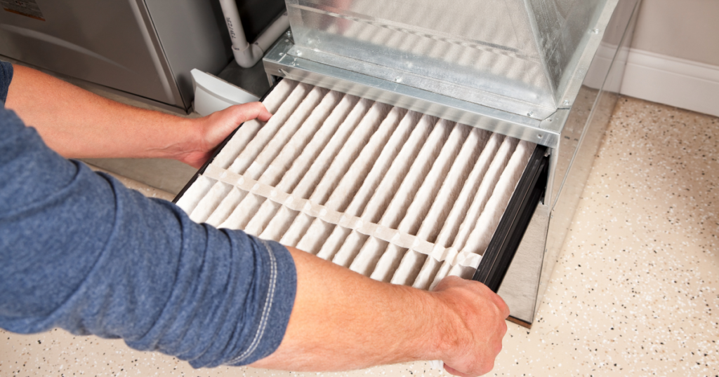 Person changing an air filter