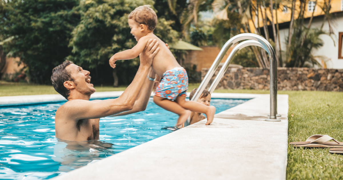 Father and son enjoying pool