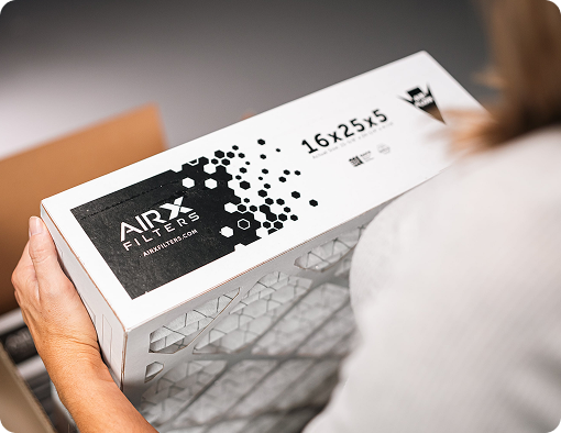 Customer holding an air filter box